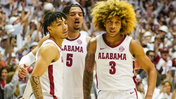 Alabama Crimson Tide guard Jahvon Quinerly (13) guard Jaden Shackelford (5) and guard JD Davison (3) celebrate after defeating the Baylor Bears at Coleman Coliseum.